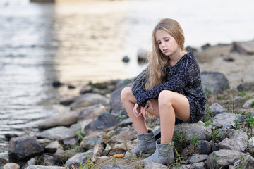 portrait of little girl outdoors in summer
