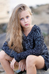 portrait of little girl outdoors in summer