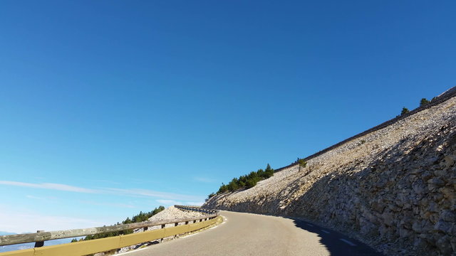 Vehicle point of view shot while driving on the road climbing the North face of the famous Mont Ventoux located in Provence in South of France.