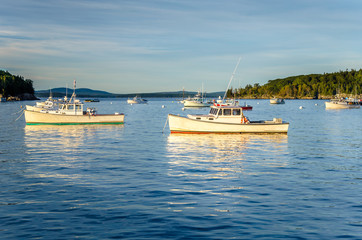 Obraz premium Fishing Boats in Harbour and Reflection in Water