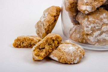Almond biscuits in powdered sugar in glass jar