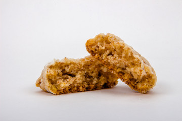 Break Italian almond cookies in powdered sugar