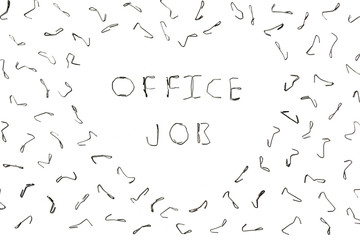 Bent staples to fasten papers. The background for your office