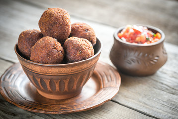Bowl of meatballs with mexican sauce salsa