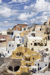 Typical houses under the clouds in Oia