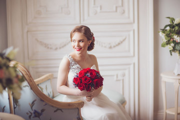 Portrait of Young Beautiful Attractive Bride with Flowers. White Dress and Wedding Decorations. Vintage Toning