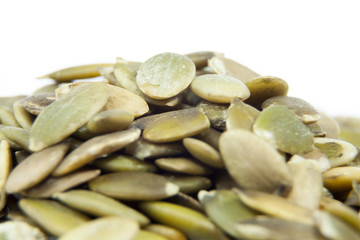 Closeup View of Pumpkin Seeds on a Plain Background