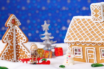 Christmas card with gingerbread house and tree