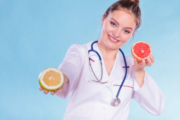 Happy dietitian nutritionist with grapefruit.