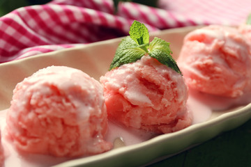 Watermelon ice cream in bowl  on color wooden background