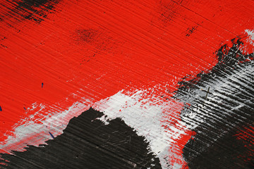 Brushstroke - white,black and red acrylic paint  on  metal surfa