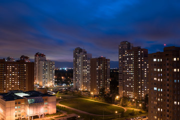Fototapeta na wymiar Residental area with school and stadium in Moscow region at night