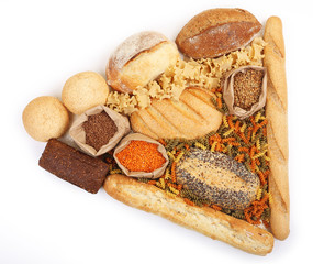 Composition of mixed breads, macaroni and grains on white background