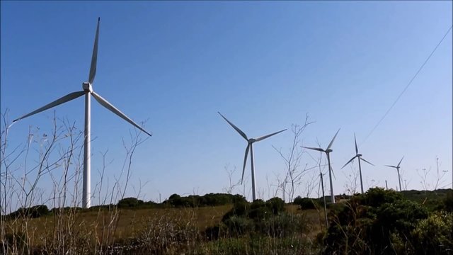 Group of operating windmills for renewable energy green project in Portugal