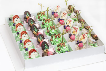 Christmas dessert canapes with cream and chocolate on a white background