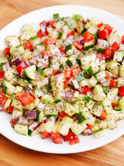 Salad with tomatos, cucumbers and red peppers