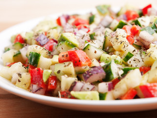 Salad with tomatos, cucumbers and red peppers