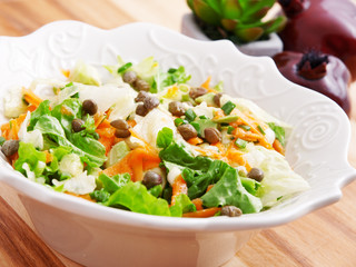 Salad with carrots, arugula and capers