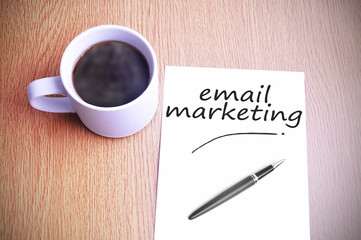 Coffee on the table with note writing email marketing