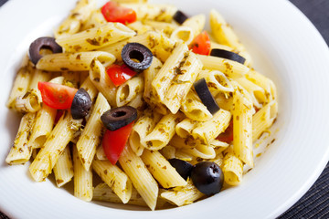 Penne with cherry tomatos and black olives