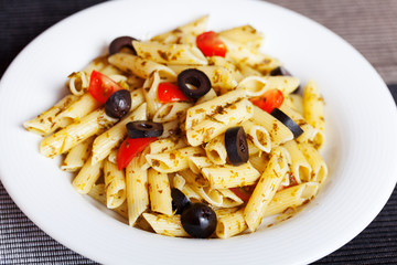 Penne with cherry tomatos and black olives