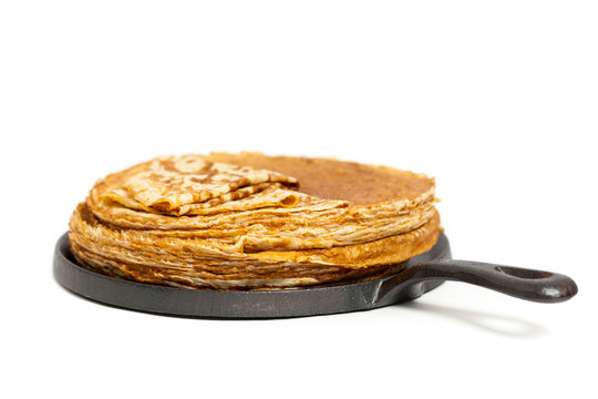 Pancakes or Russian Blintzes on white background. Selective focus.