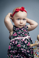 infant little girl with red bow