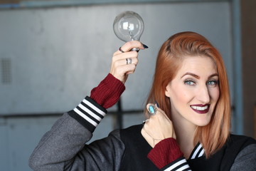 Misunderstanding red-haired girl isolated. Rich face expression. Concept of idea.