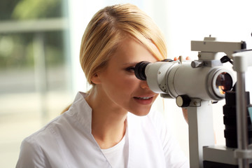 Adult female doctor examing a patient