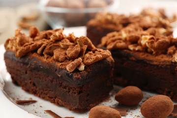 Pieces of chocolate cake with walnut on the table, close-up