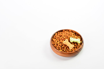 Dry dog food in bowl on white background
