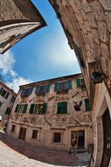 Fish-eye view of the old city on sky background