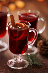 Mulled wine on wooden table, close-up