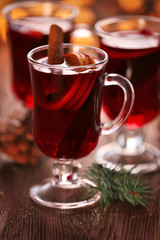 Mulled wine on wooden table, close-up