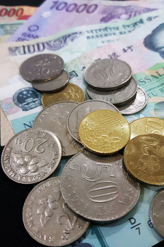 Close up of various country currency note and coins. Soft focus and selective focus image