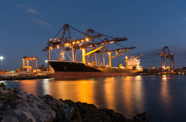 The container ship in port during loading container into ship