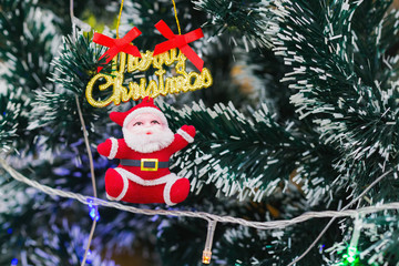 Santa Claus doll on Christmas trees.
