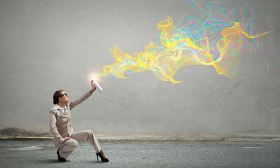 Woman spraying colors