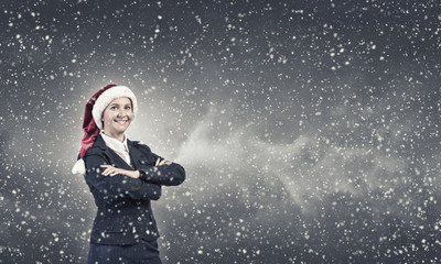 Naklejka premium Businesswoman in Santa hat