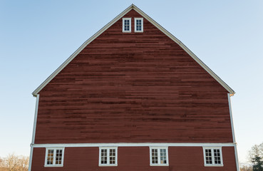 Unique red barn and blue sky on an old farm