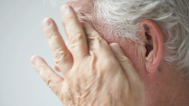 mature man with eyestrain