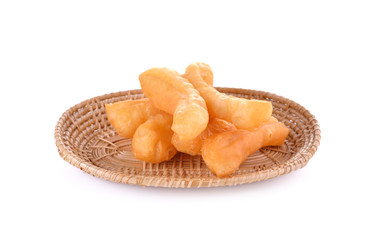deep fried dough stick on wicker basket with white background