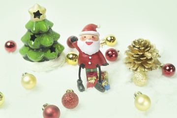 Santa claus sits on the top of the gift boxes.