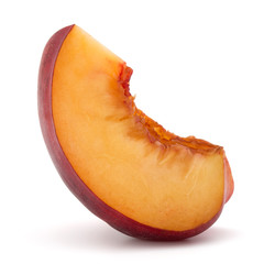 Nectarine fruit slice isolated on white background close up