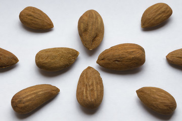 Almonds on white background