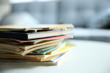 Pile of old books on white table