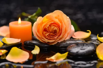 Keuken spatwand met foto Orange rose with petals with candle and therapy stones  © Mee Ting
