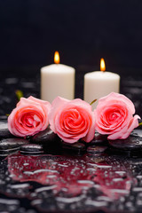 Set of three pink rose with candle on therapy stones 