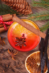 Mulled wine for christmas or winter evening with spices and spruce branches