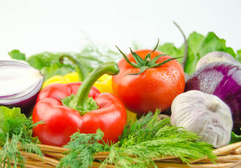 Vegetables and herbs in a wicker basket
